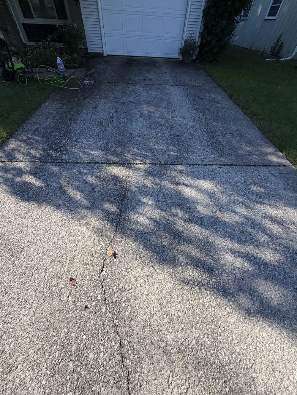 Driveway before pressure washing